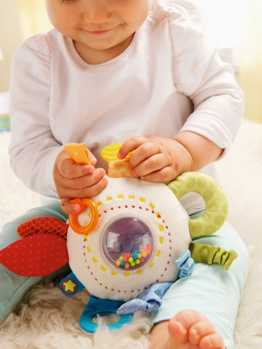 cuddly rainbow activity toy