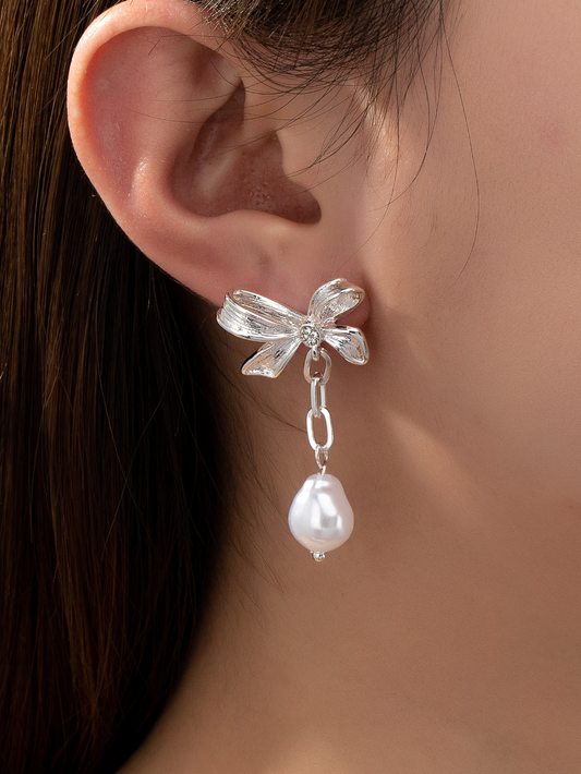 silver bow pearl earrings