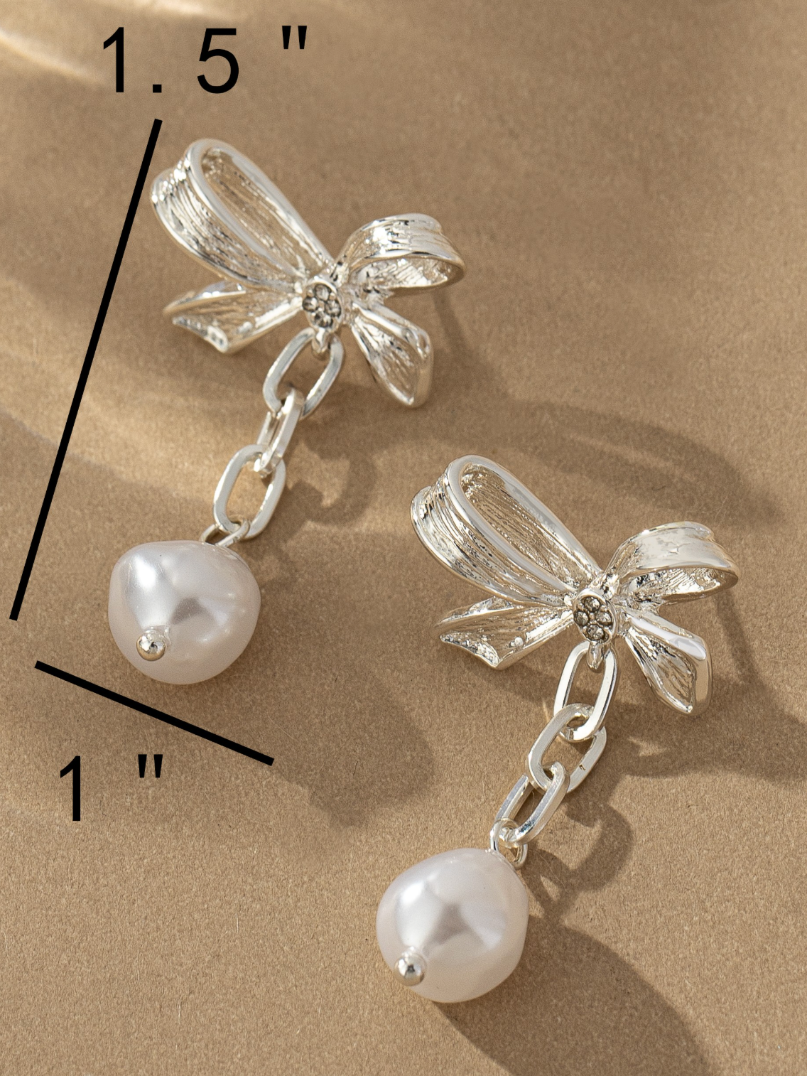 silver bow pearl earrings