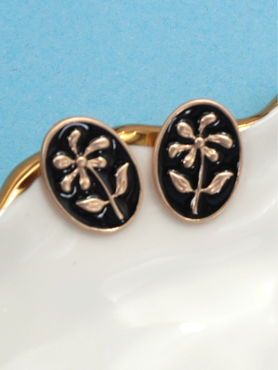 black dainty flower studs