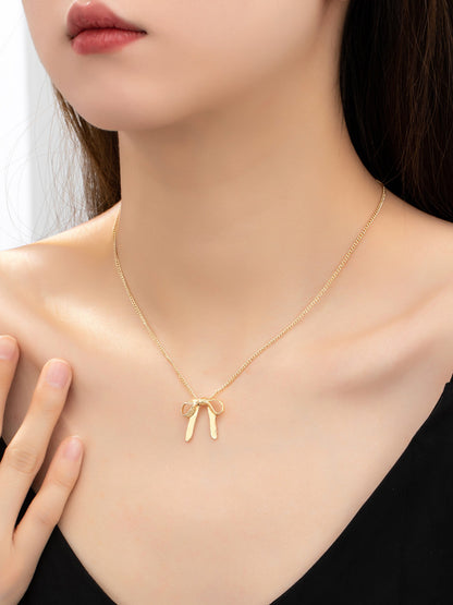 gold bow dainty necklace