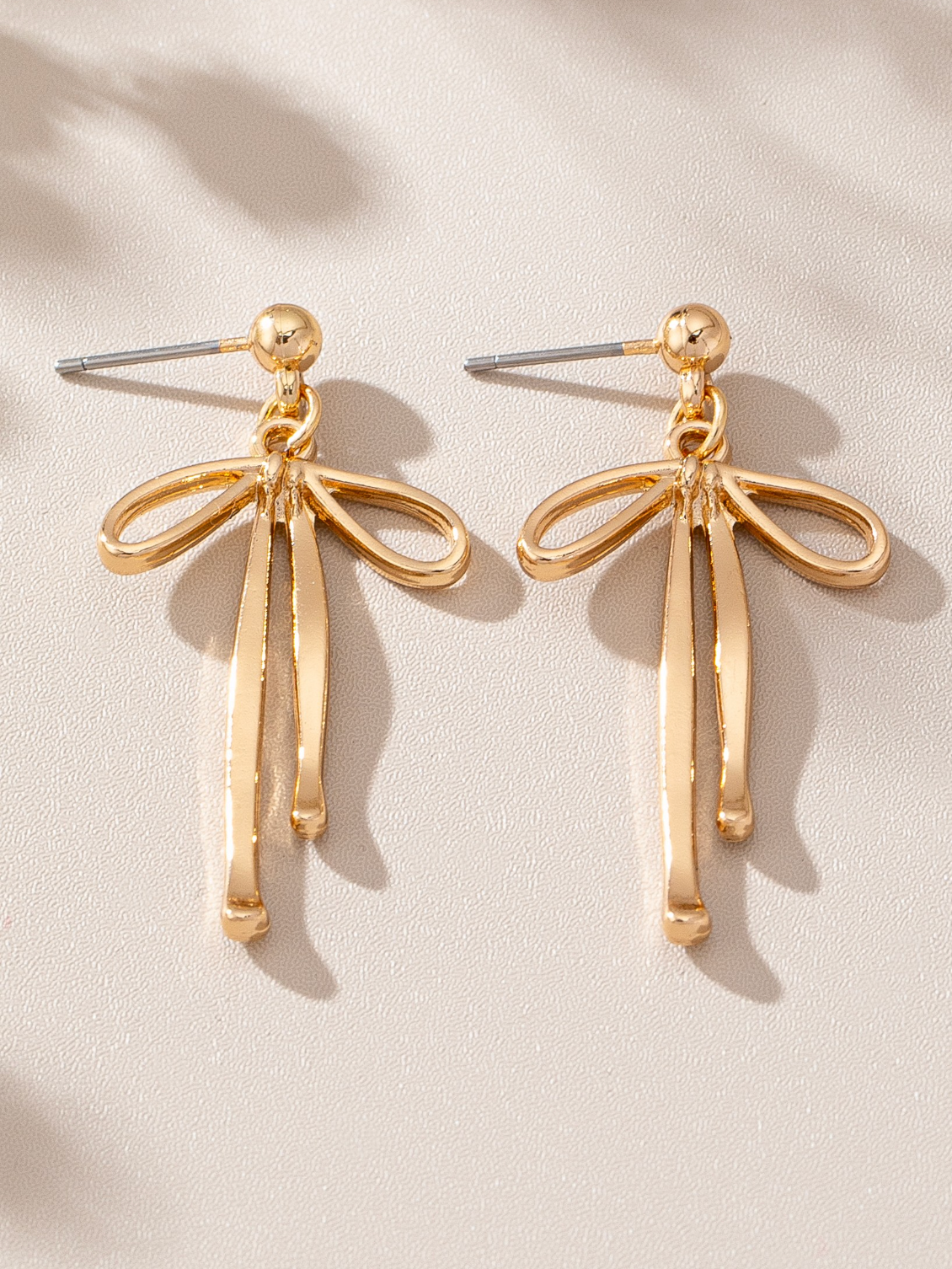 gold bow drop earrings