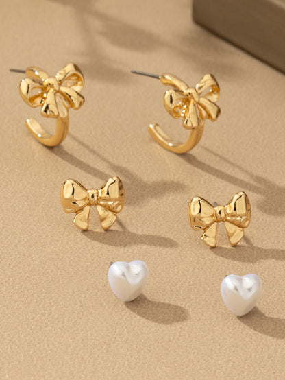 gold bow stud set