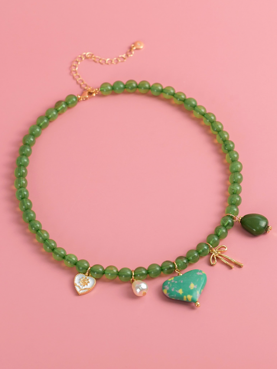 green beaded heart charm necklace