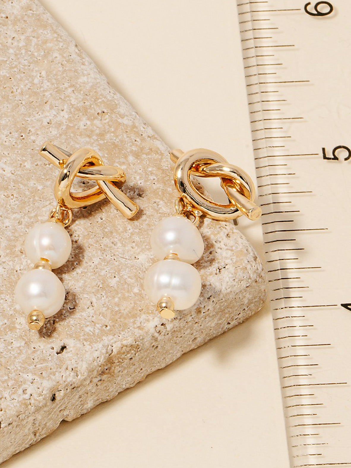 knotted pearl dangly studs