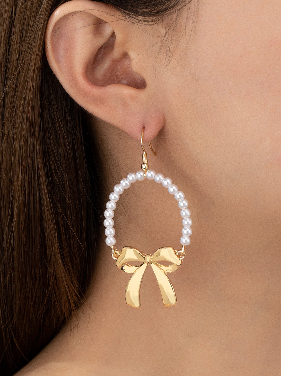 pearly bow dangly earrings