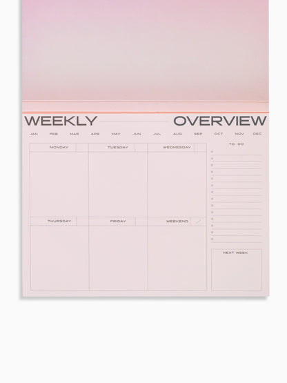 surreal weekly desk planner