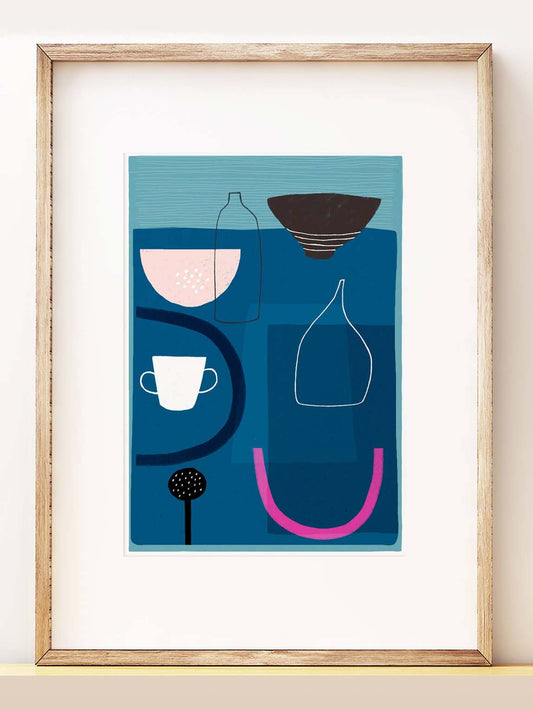 the blue still life print in a frame